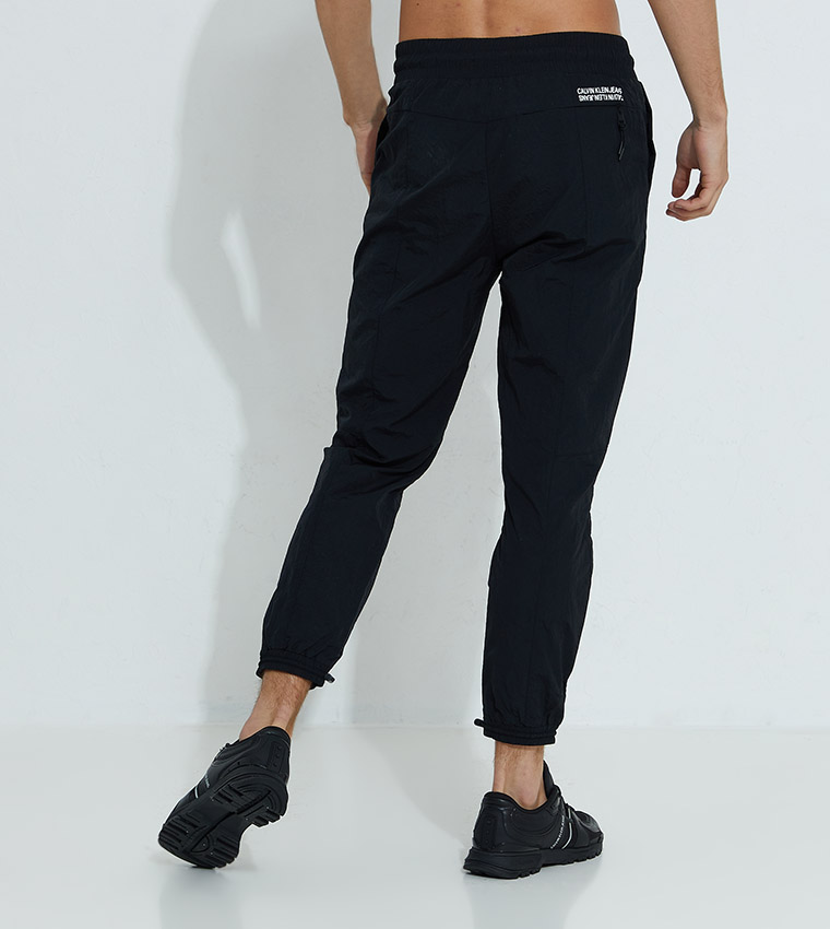 Buy Calvin Klein Recycled Nylon Tracksuit Bottoms In Black