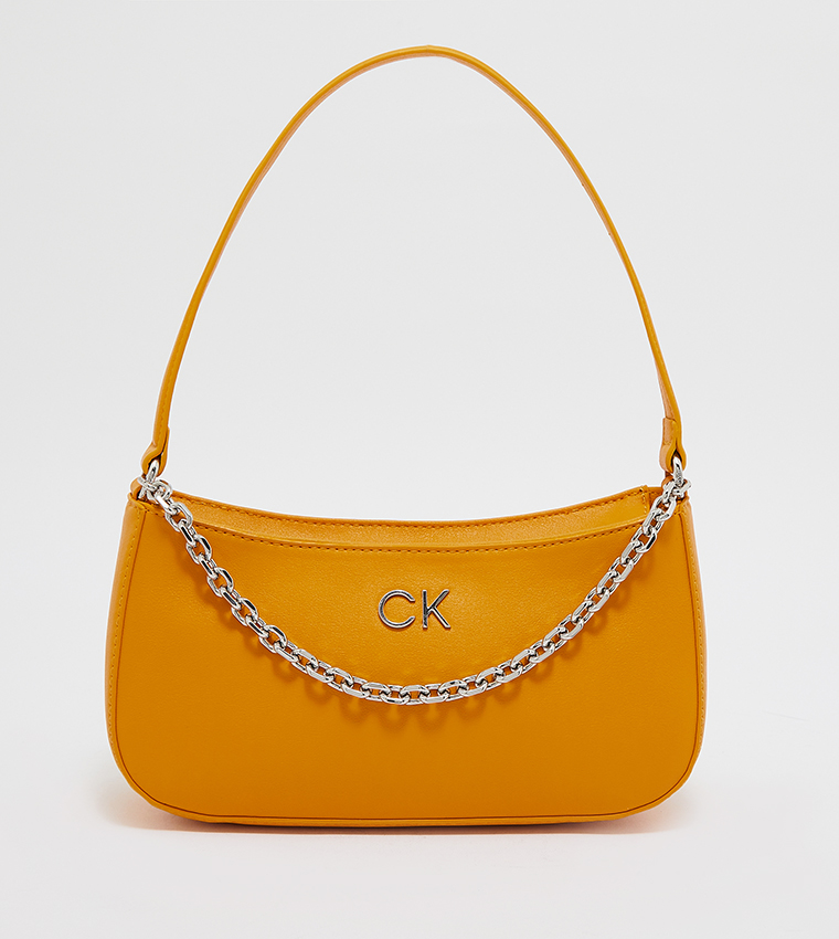 Buy Calvin Klein Solid Shoulder Handbag In Orange | 6thStreet Kuwait
