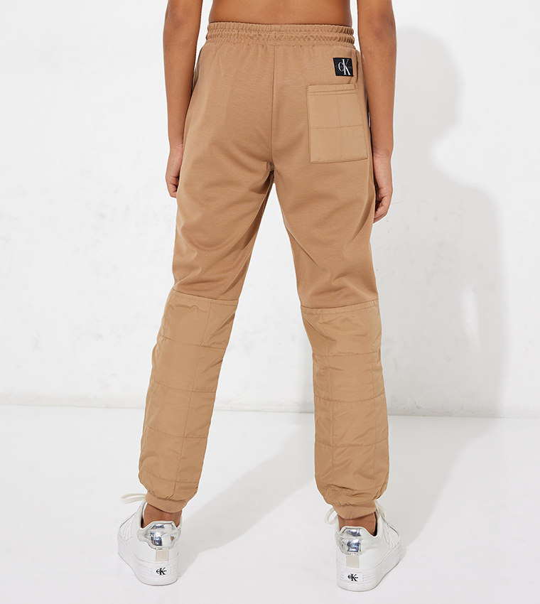 Buy Calvin Klein Quilted Logo Printed Pants In Brown