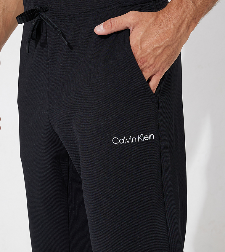 Buy Calvin Klein Men Black Elasticized Waist Solid Track Pants - NNNOW.com