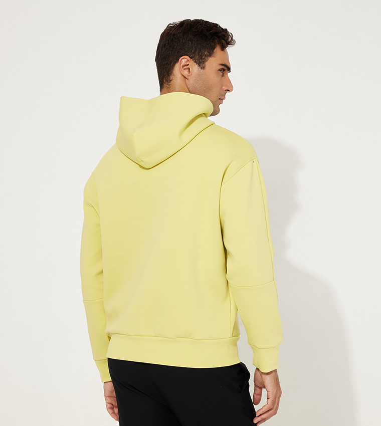 Buy Calvin Klein Logo Embossed Long Sleeves Hoodie In Yellow 6thStreet Bahrain