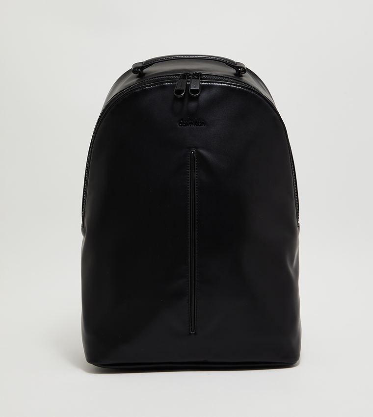 Round leather backpack with all-over embossed eagle