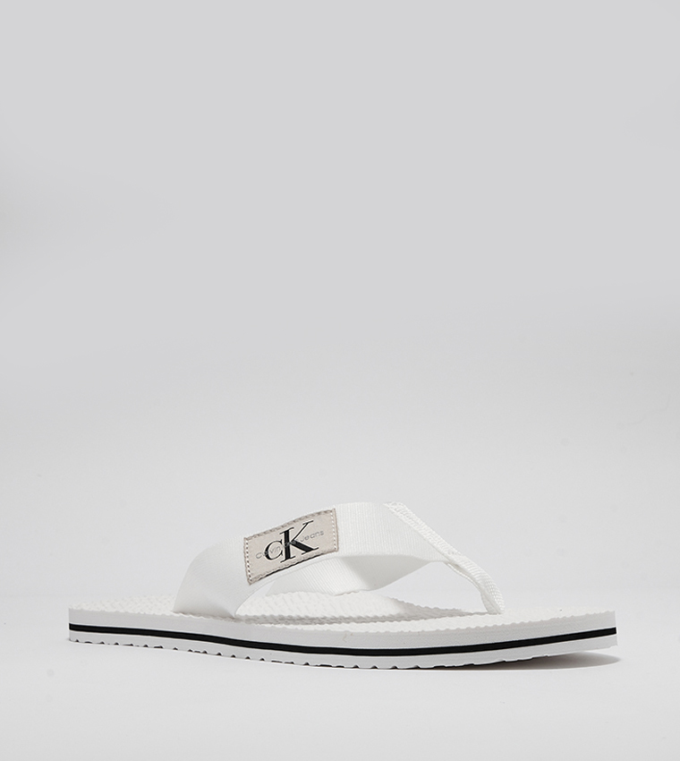 Calvin klein white hotsell flip flops