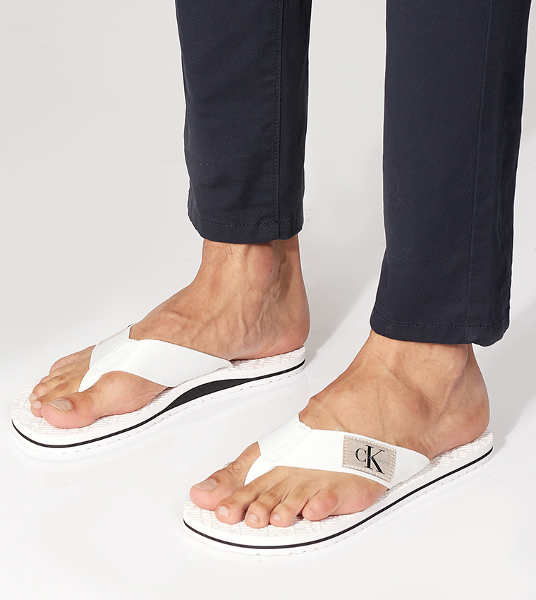 Calvin klein white hotsell flip flops