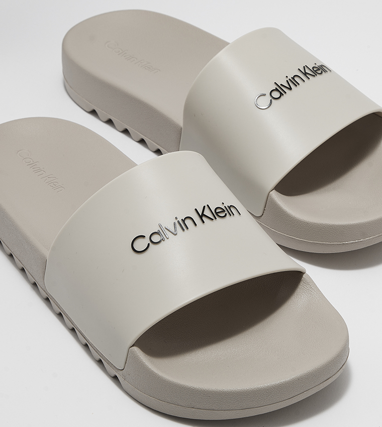 Buy Calvin Klein Logo Detail Pool Slides In Grey 6thStreet UAE