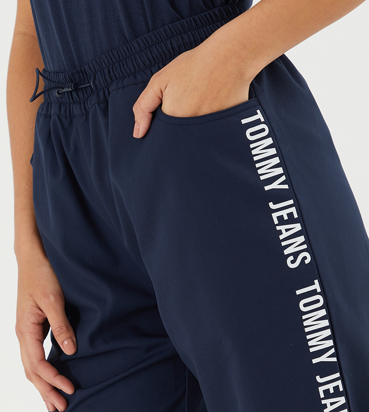 Buy Tommy Hilfiger Repeat Logo Tape Relaxed Fit Joggers In Blue