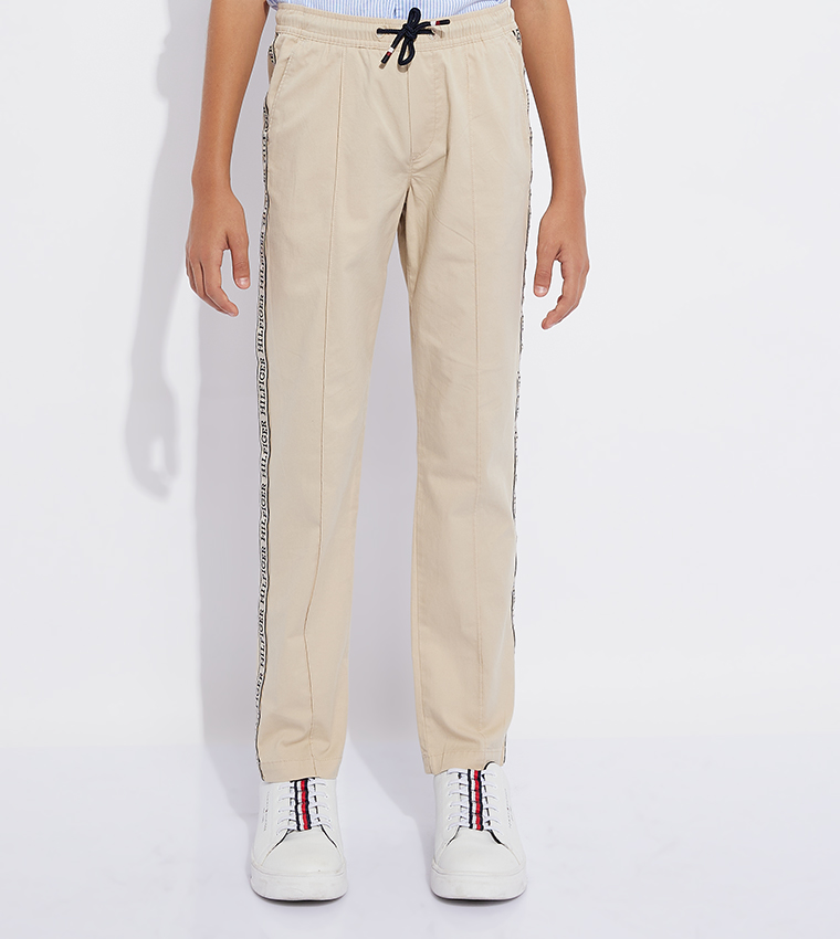 Buy Tommy Hilfiger Monotype Tape Drawstring Waist Pants In Beige