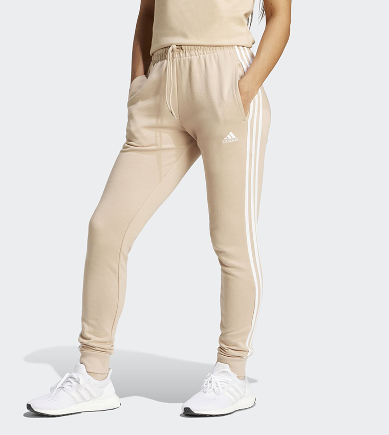 Buy Adidas Essentials 3 Stripes French Terry Joggers In Beige 6thStreet Saudi Arabia