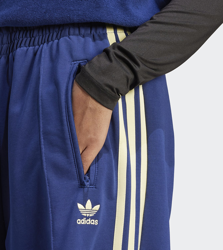 Buy Adidas Logo Detail Loose Fit Track Pants In Blue