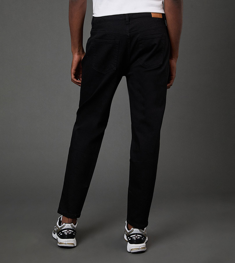 Solid Stretch Tapered Fit Jeans