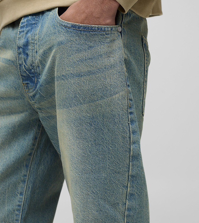 Rigid Faded Mid Rise Flared Jeans