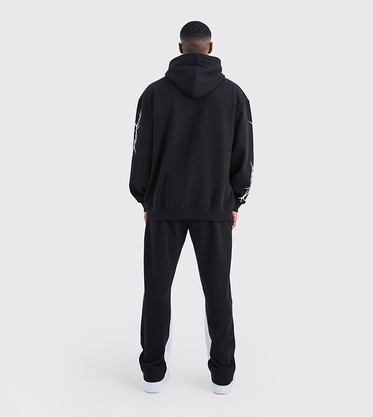 Buy BoohooMAN Graffiti Gusset Hooded Oversized Sweatsuit Set In