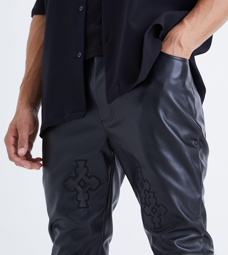 Buy BoohooMAN Tall Pu Stacked Applique Flared Trousers In Black