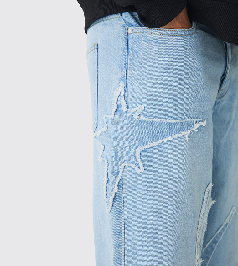 Rigid All Over Raw Edge Appliqued Baggy Jeans