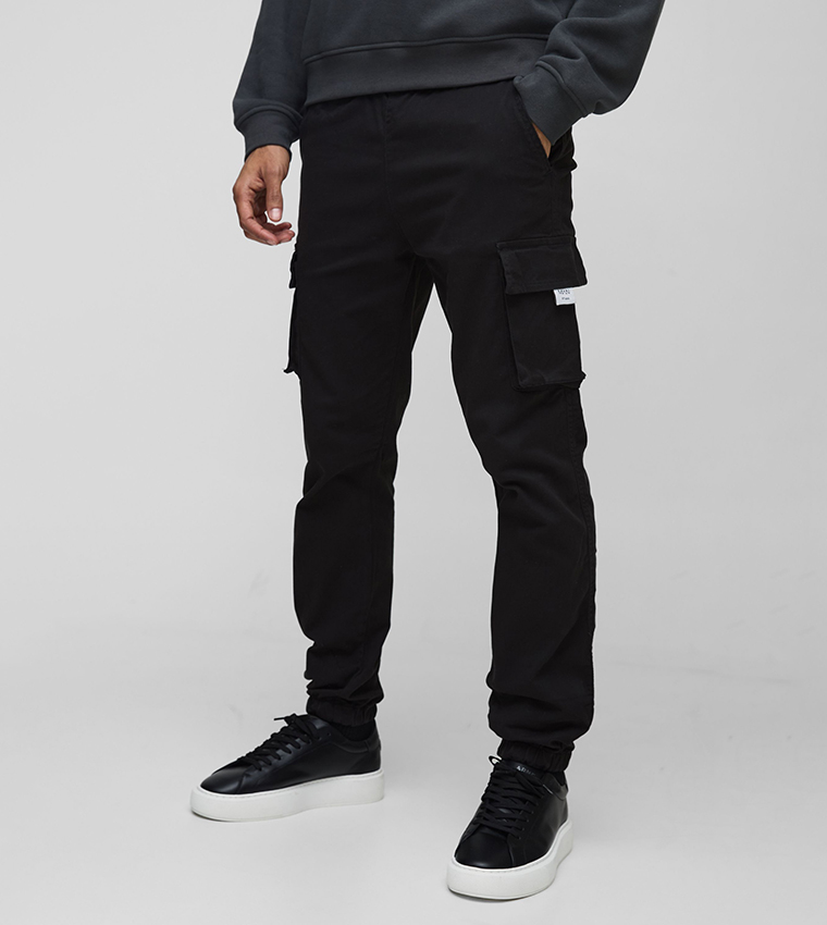 Buy BoohooMAN Mid Rise Cuffed Cargo Trousers In Black 6thStreet Oman