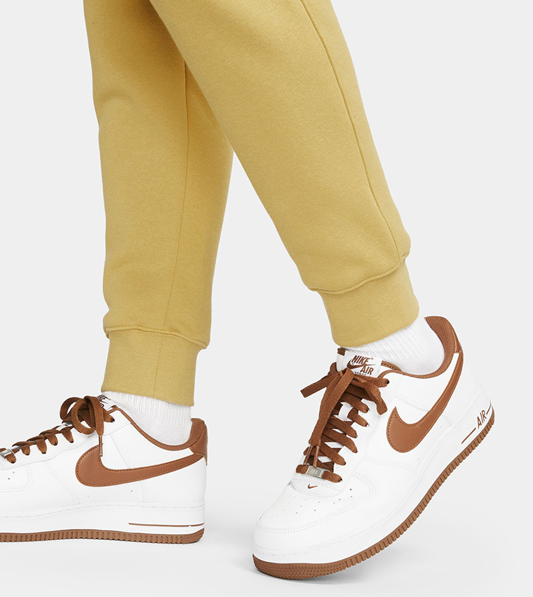Buy Nike Logo Printed Club Joggers In Yellow 6thStreet UAE