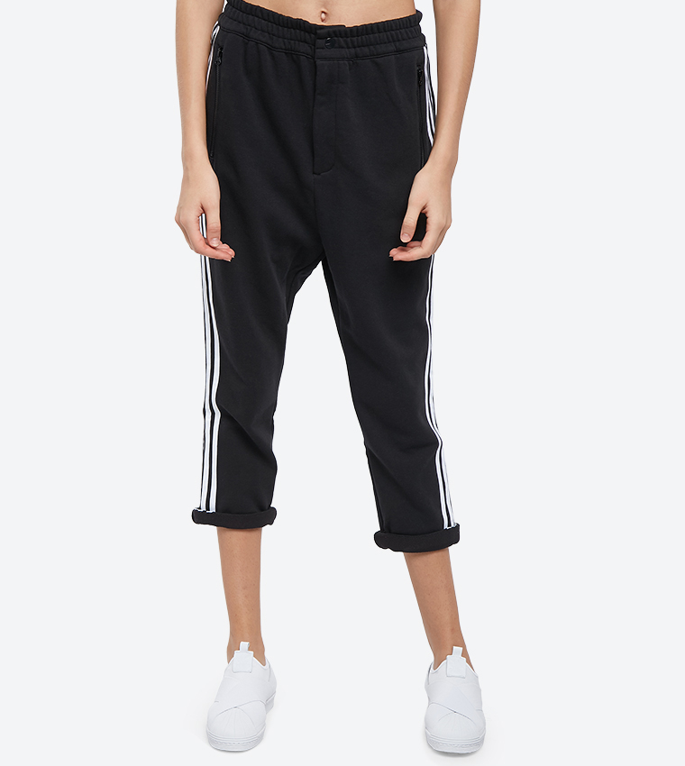 Adidas styling complements cropped pants on sale