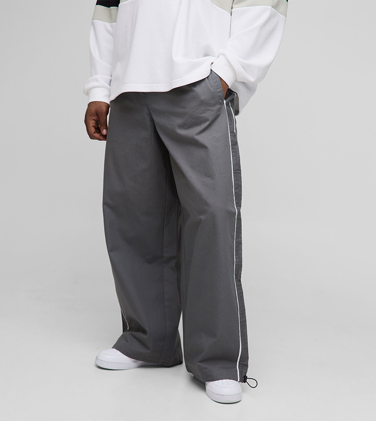 Buy BoohooMAN Washed Ripstop Side Striped Parachute Trousers In