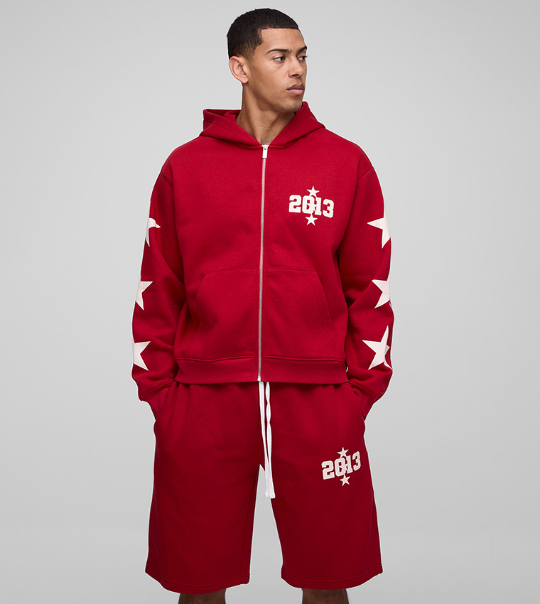 Buy BoohooMAN Star Printed Hooded Oversized Shorty Tracksuit Set