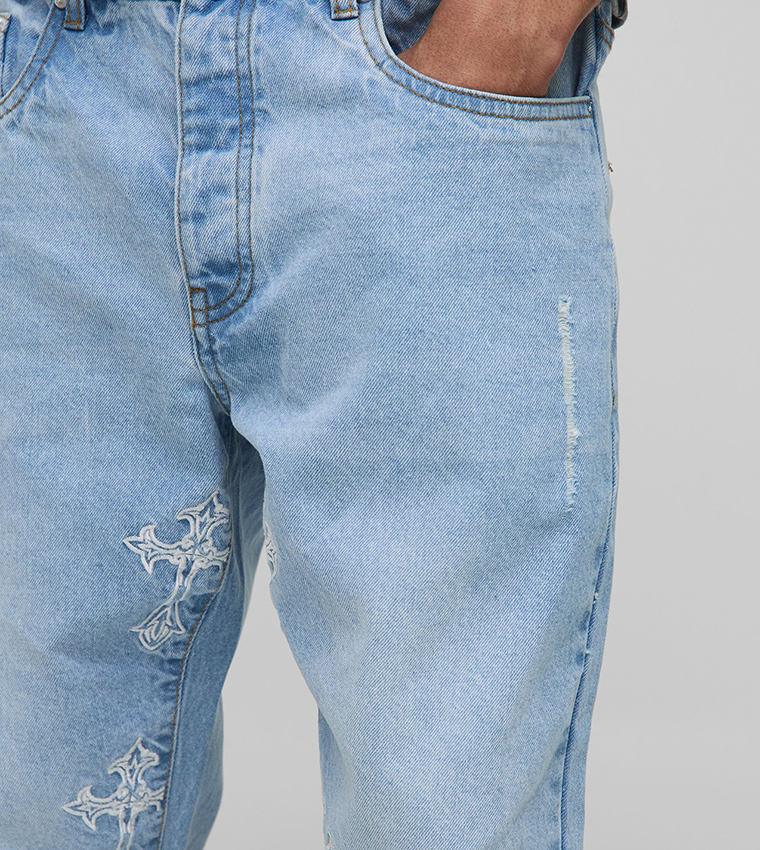 Distressed Cross Gusset Embroidered Flared Slim Fit Jeans