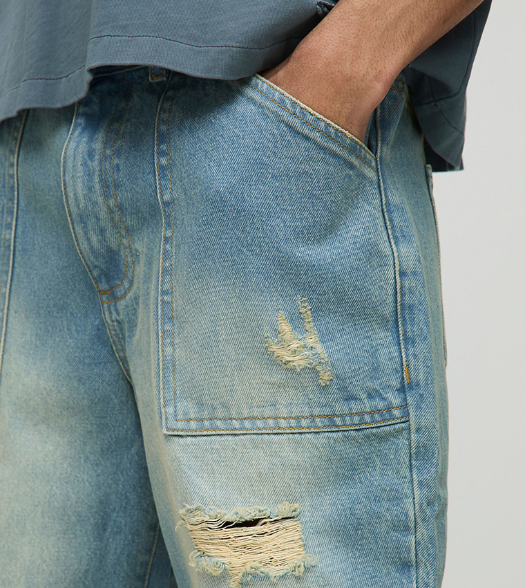 Relaxed Rigid Washed Ripped Paneled Flared Jeans
