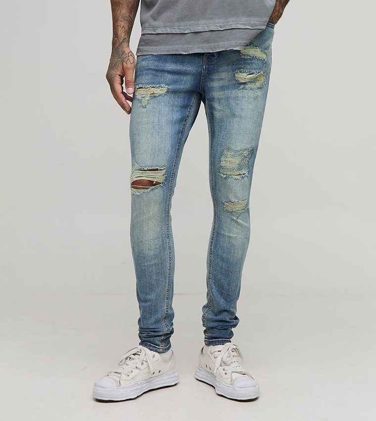 Buy BoohooMAN Tall Distressed Super Skinny Fit Jeans In Blue