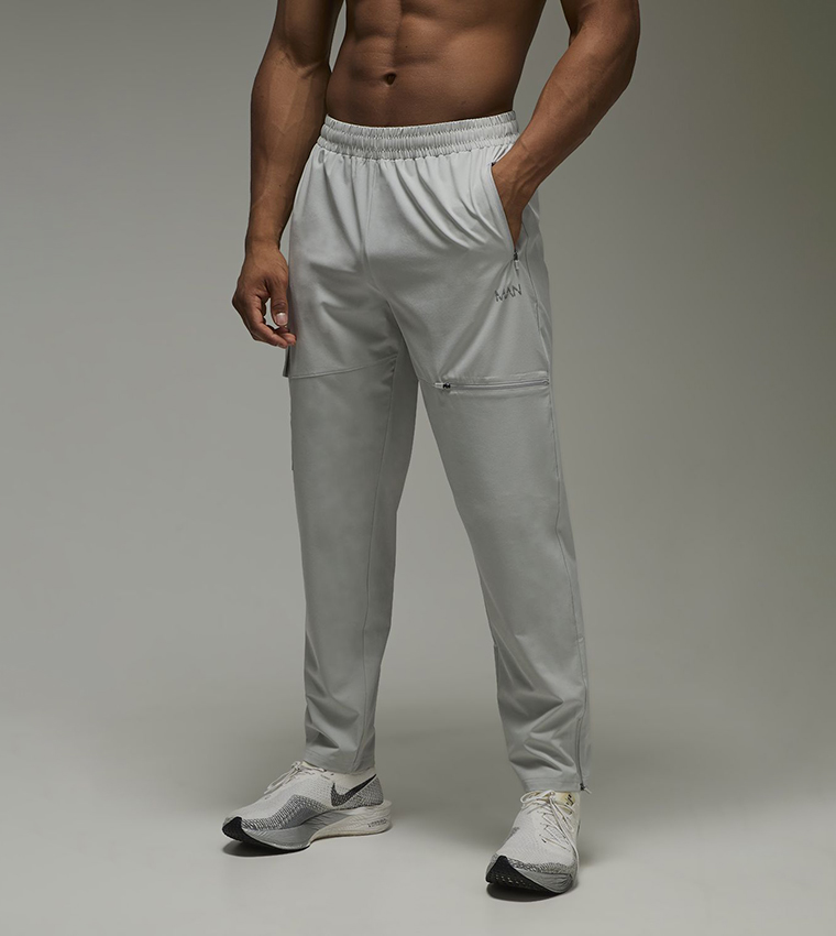 Buy BoohooMAN Zip Pocket Regular Fit Active Cargo Joggers In Grey