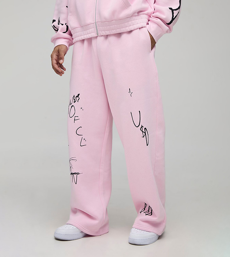 Buy BoohooMAN Graffiti Print Wide Leg Sweatpants In Pink