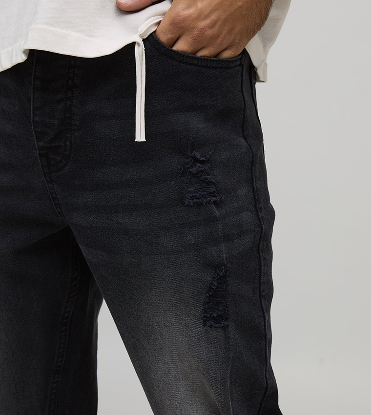 جينز مغسول وممزق 