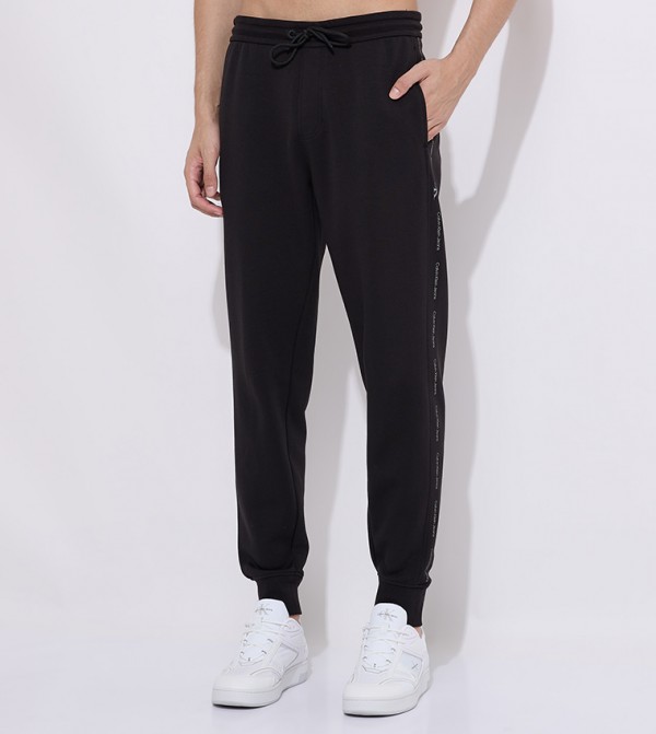 كالفين كلاين  بنطلونات و تشينو  - أسود جوغر