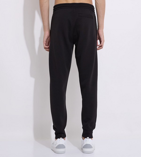 كالفين كلاين  بنطلونات و تشينو  - أسود جوغر