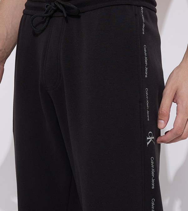 كالفين كلاين  بنطلونات و تشينو  - أسود جوغر