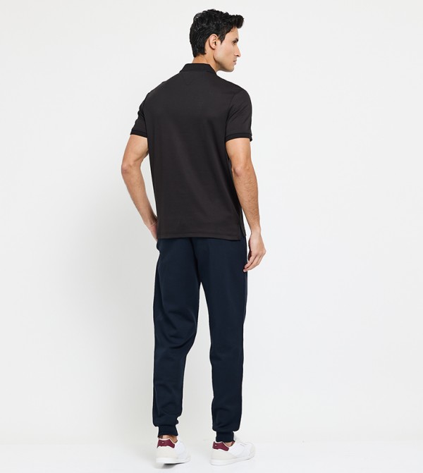 تومي هيلفيغر  ملابس - أسود قمصان بولو