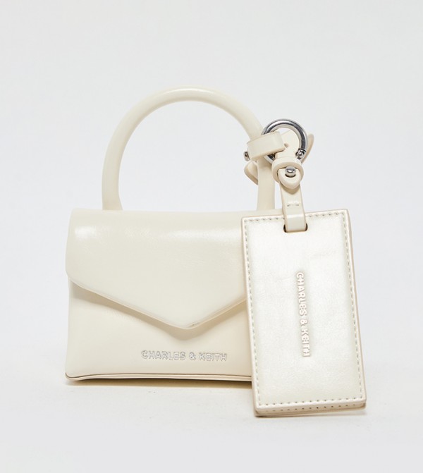 Charles & Keith  Travel Accessories - Cream Key chains