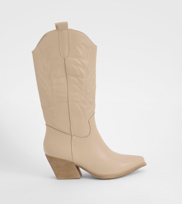 Knee high boots in store shop
