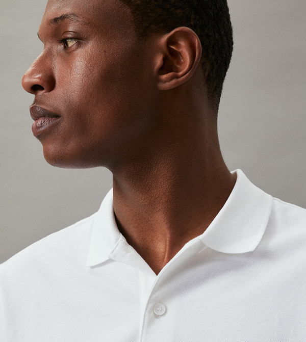Calvin Klein  Clothing - White Polo T-shirts