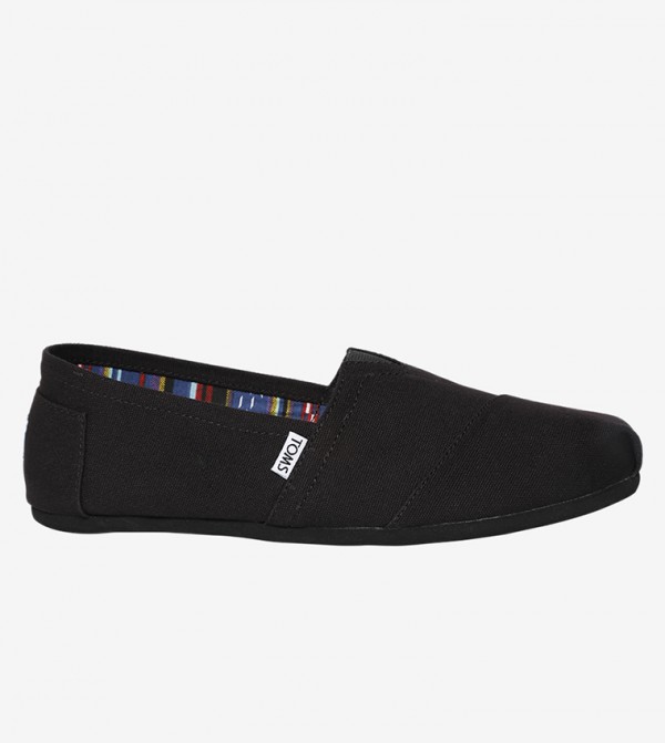toms black slip ons
