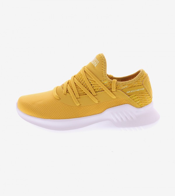 gold athletic shoes