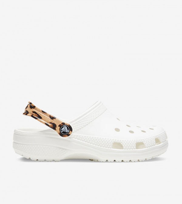 white and leopard crocs