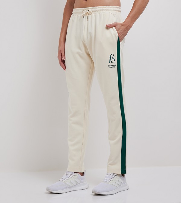 Buy Nike Swoosh Woven Pants White in UAE