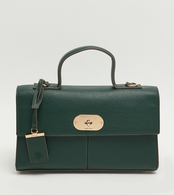 شنطة نسائية بقفل دوّار