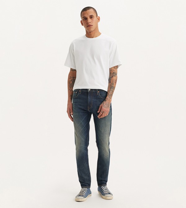 512™ Faded Slim Tapered Fit Jeans