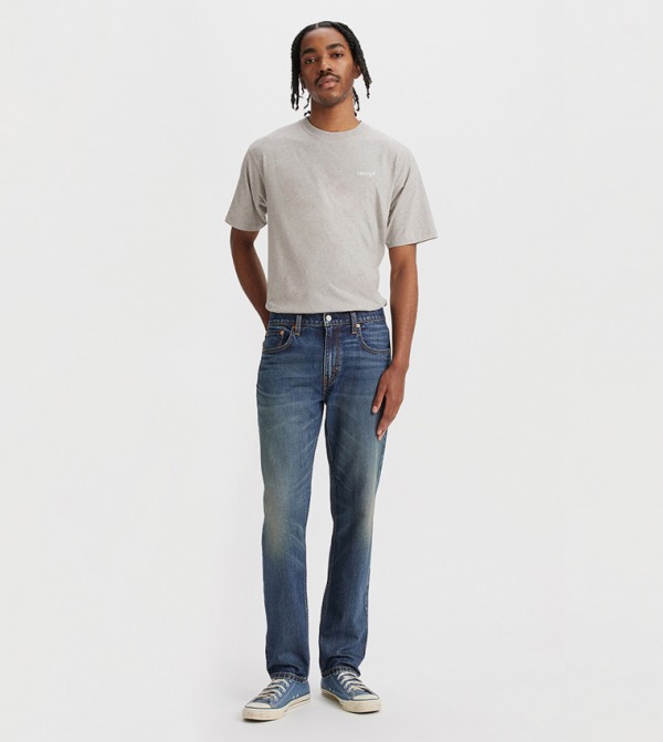 502 Faded Mid Rise Tapered Jeans