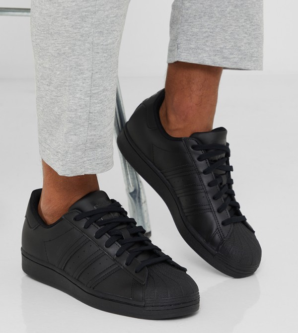 Low top black store adidas