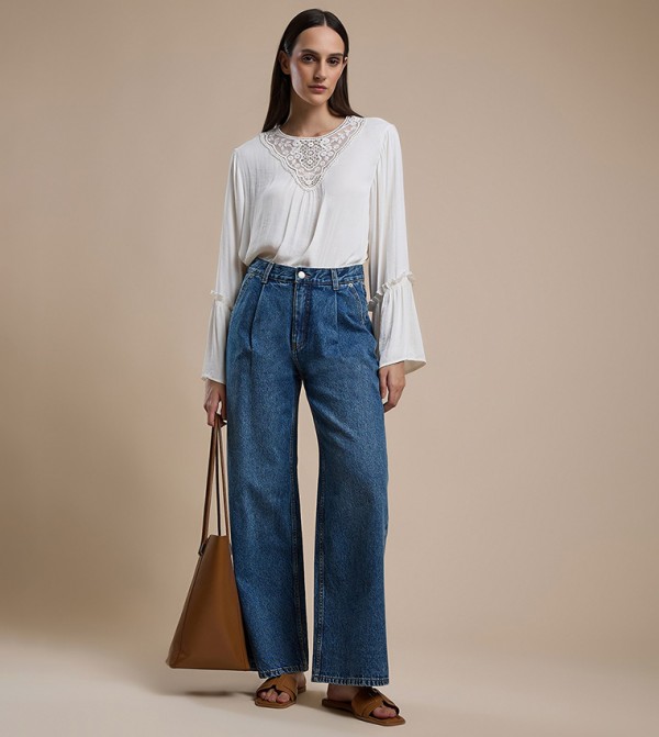 Washed Pleated Jeans with Button Closure