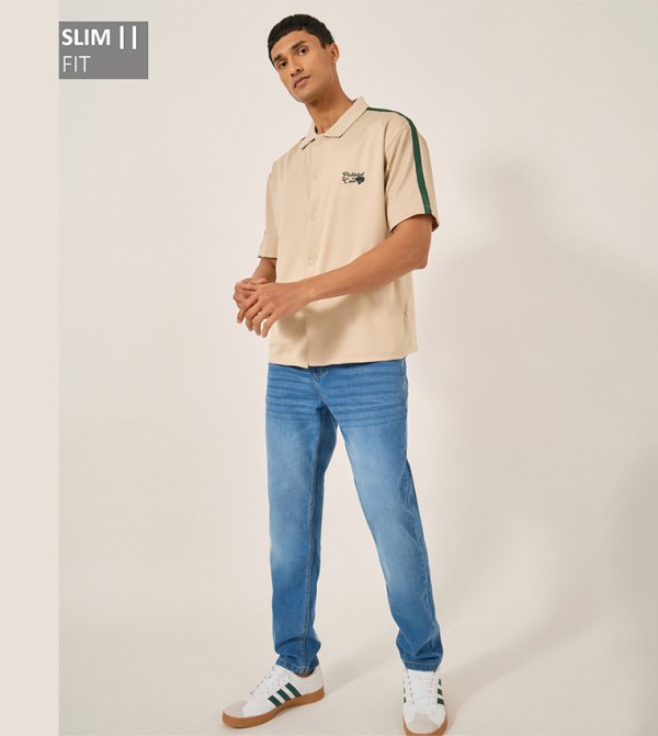Mid Rise Faded Slim Fit Jeans
