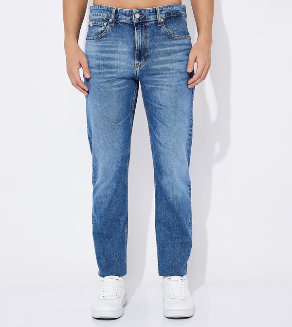 Faded Mid Rise Tapered Fit Jeans