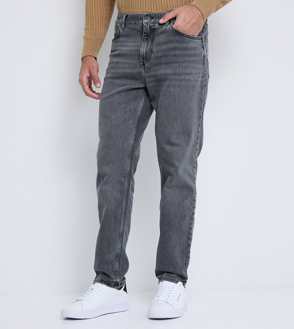 Washed Mid Rise Tapered Fit Jeans