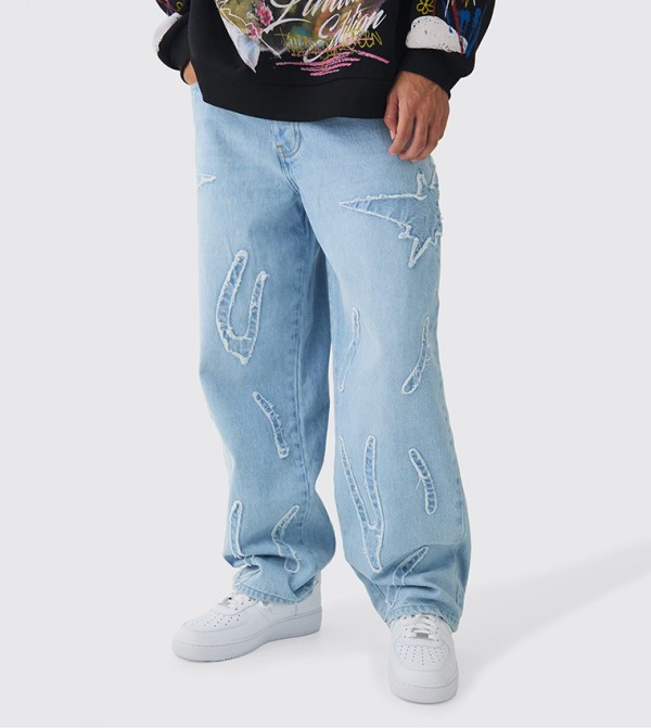 Rigid All Over Raw Edge Appliqued Baggy Jeans