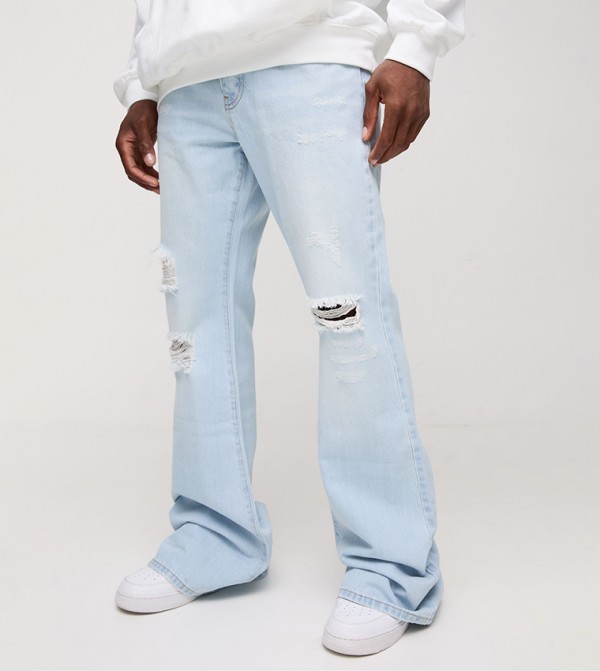 Rigid Flare Stacked Knee Ripped Relaxed Fit Jeans